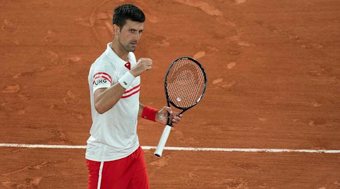 Jun 11, 2021; Paris, France; Novak Djokovic (SRB) celebrates winning his semifinal match against Rafael Nadal (ESP) on day 13 of the French Open at Stade Roland Garros.